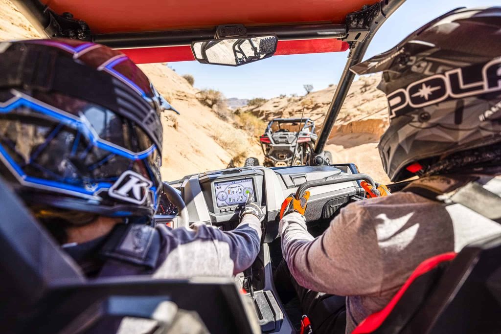 Two Adventus Club members drive an ATV and they enjoy driving.